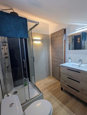 Shower, eco-friendly toiletries, hair dryer, bidet