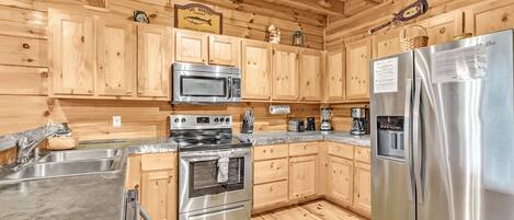 Réfrigérateur, four à micro-ondes, lave-vaisselle, cafetiÚre-théiÚre