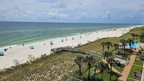 A beach resort with a wooden boardwalk, a swimming pool, and a sandy beach. - Sandy Key 524:  2 BR / 2 BA Gulf Front Condo in Perdido Key, FL  Sleeps 6 (Pensacola)