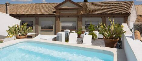 Outdoor pool, open 11:00 AM to 10:00 PM, sun loungers