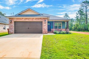 Stylish single-story home with a gabled roof and cozy front porch.