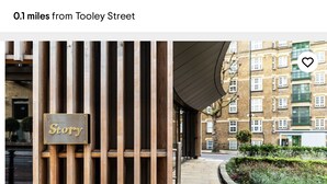 A restaurant sign with a wooden facade and a plaque reading "Story." - Immaculate One Bed in Tower Bridge Luxurious Taste (London)