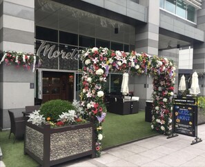 Welcome to Moretown Belle, where a modern entrance invites you to relax in the beautifully maintained lawn area with comfortable outdoor seating.