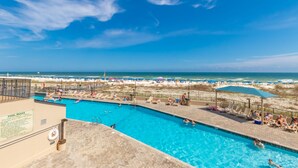 A swimming pool with a view of the beach and ocean. - Perfect location at Phoenix X next door to FloraBama (Orange Beach)