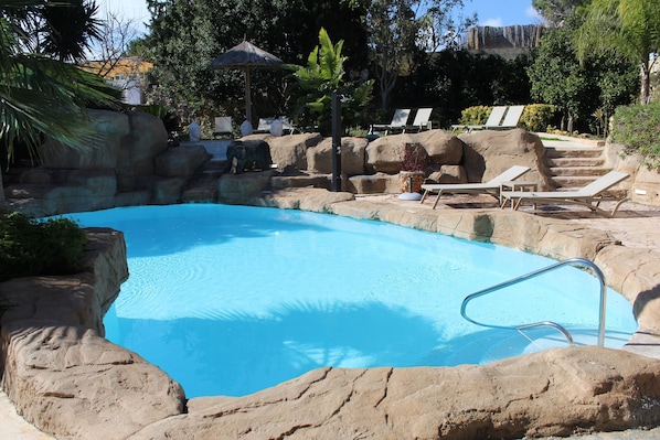 Indoor pool, outdoor pool, open 9:00 AM to 10:00 PM, pool umbrellas