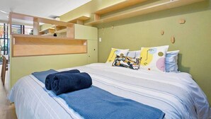 A hotel room with a bed, a wooden headboard, and a view of the outdoors. - Serenity in the City - 1BD Studio, Wifi, CBD (Adelaide)