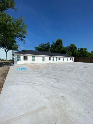 Accessible building with uniform rooms and a parking area.