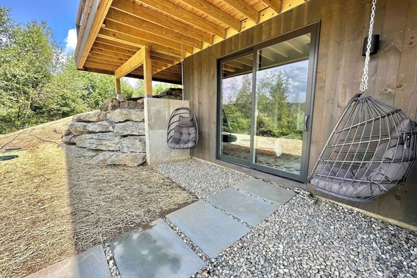 Relaxing egg chairs outside the second master bedroom, near back deck fire pit