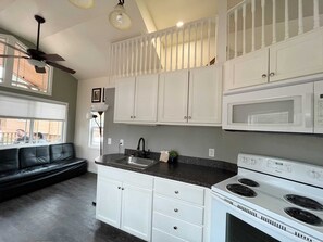 Fridge, microwave, oven, dining tables