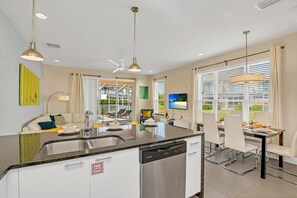 Enjoy cooking in this well-equipped kitchen with a central island and dishwasher.