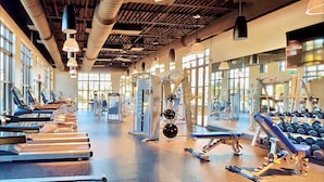 A gym with treadmills, weight machines, and dumbbells. - Mickey | Pool | Surf Simulator | 7 Miles Disney 1600 (Kissimmee)