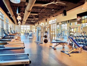 A gym with treadmills, weight machines, and dumbbells. - Private Pool-Games! Resort 7 mi 2 Disney! 1748 (Kissimmee)