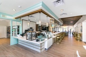 Enjoy meals and socializing around the central island counter with bar stools and a long counter.