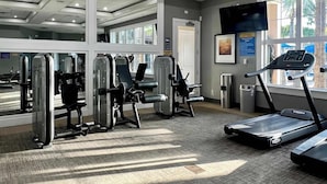 A gym with cardio equipment, weight machines, and a treadmill. - Waterpark | Private Pool | 6 Mi 2 Disney 4686 (Davenport)