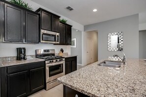 Microwave, dishwasher, coffee/tea maker, paper towels