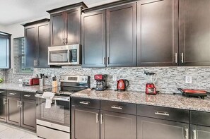 Microwave, coffee/tea maker, dining tables