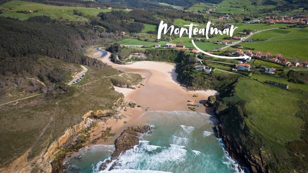 An aerial view of Montealmor, featuring a coastal landscape with a beach, rocky shoreline, and surrounding green fields. - Montealmar Galizano Somo (ribamontan al mar)