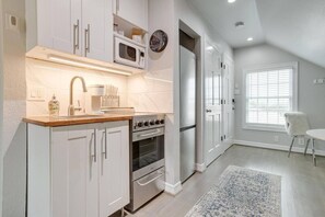 Fridge, microwave, coffee/tea maker, cookware/dishes/utensils