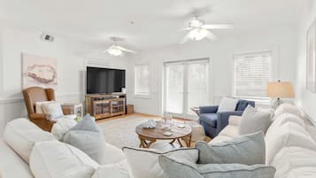 Condo, Multiple Beds, Pool Access, Garden View (#106 - No Pets) | Living area | TV