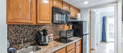 Fridge, microwave, stovetop, coffee/tea maker