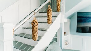 A staircase with a metal railing and three rope swings hanging from it. - Waterfront with spectacular views, peaceful and private duplex, fishermens dream (Beaufort NC)