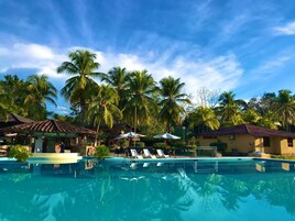 Outdoor pool, open 10:00 AM to 8:00 PM, pool umbrellas