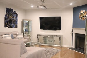 Smart TV, fireplace, smart speakers