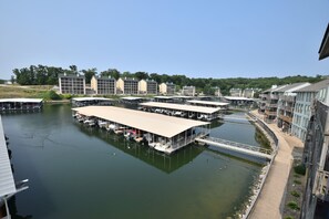 A marina with several docked boats and a covered boat house.