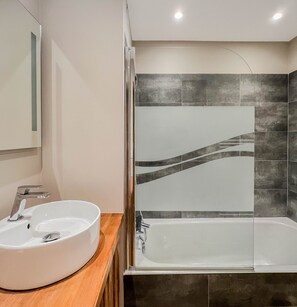 Bathtub, hair dryer, towels, soap
