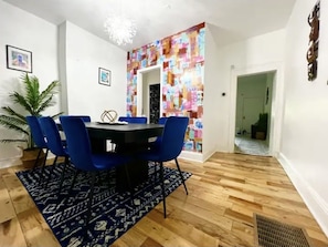 Enjoy meals in this cozy dining area with a round table and comfortable seating for all.