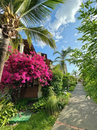 Rooftop Sunset Cove, This spacious and sunlit apartment features 2 bedrooms, 1.5 bathrooms, a stunning rooftop terrace