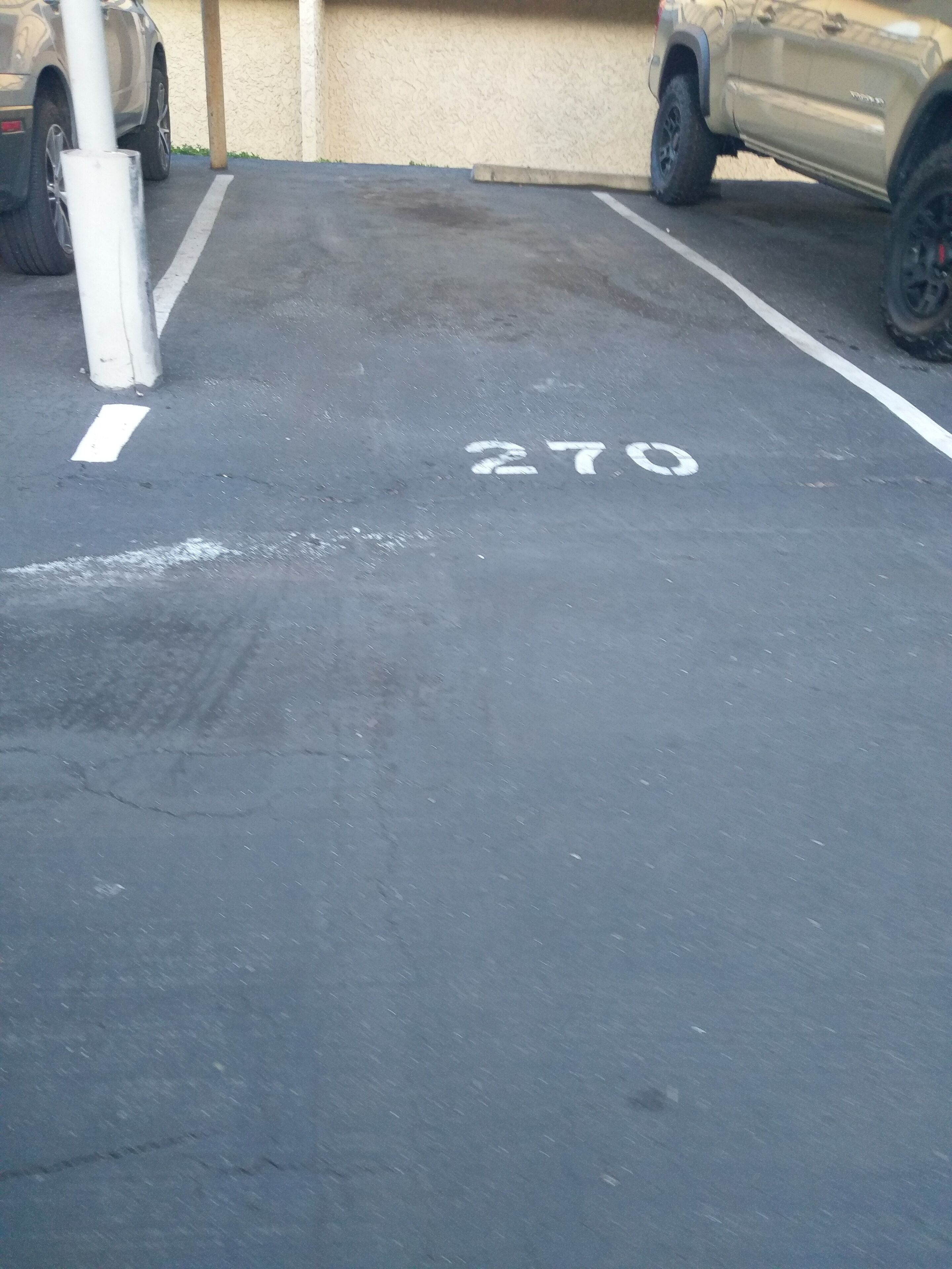 A parking lot with marked spaces, including a space labeled '270'.