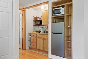 Fridge, microwave, stovetop, coffee/tea maker