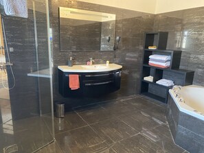 Shower, hair dryer, towels, soap