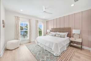 A bedroom with a bed, bedside tables, a ceiling fan, and a window with curtains. - 30 A-mazing! Private Heated Pool, 4 bedroom, 6 Seater Golf Cart & Bikes! (Santa Rosa Beach)