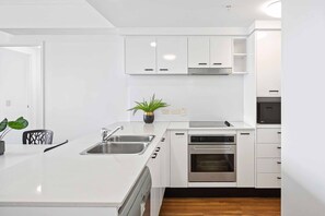 Enjoy cooking in this well-equipped kitchen with a dishwasher, oven, and microwave.