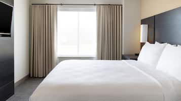 Premium bedding, pillow-top beds, desk, laptop workspace
