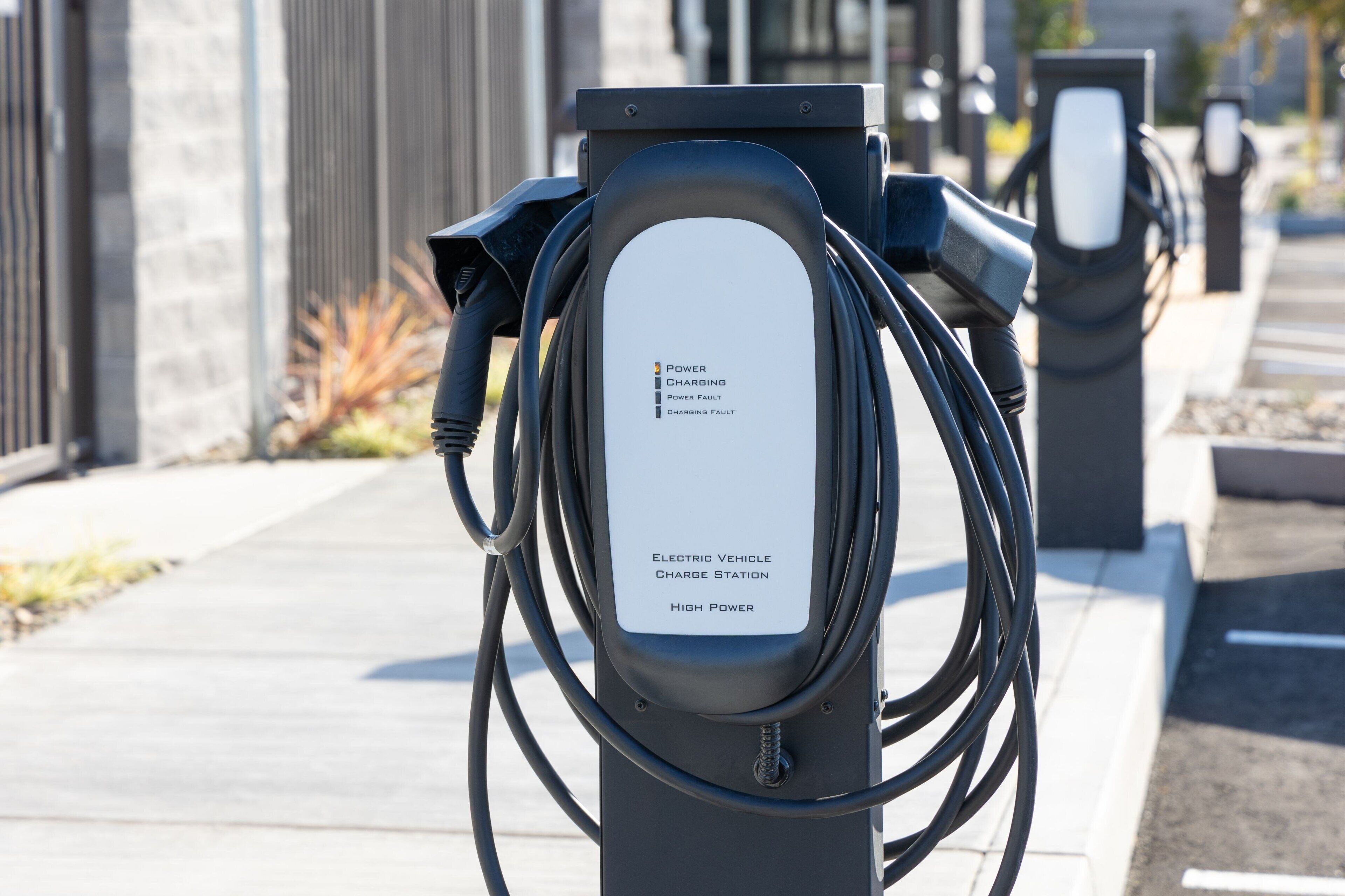 An electric vehicle charging station with a label indicating it is a high power station.