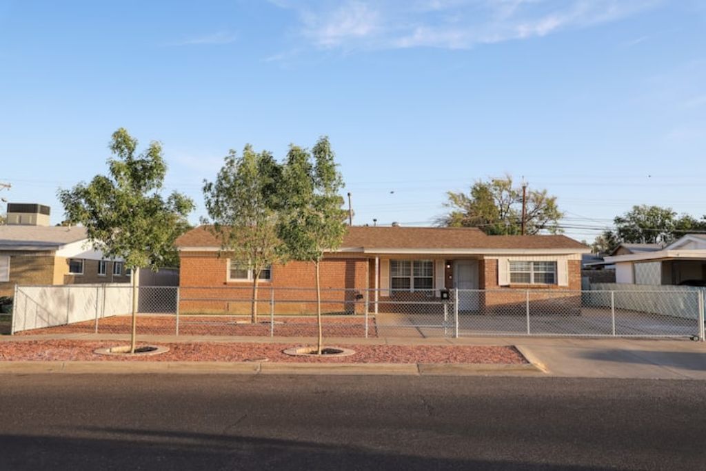 A single-story building with a brick exterior and a flat roof.