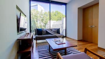 Premium Apartment, 2 Bedrooms, Balcony | Living area | 55-inch flat-screen TV with digital channels, TV, Netflix