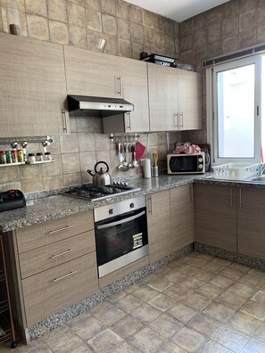 Oven, paper towels, dining tables