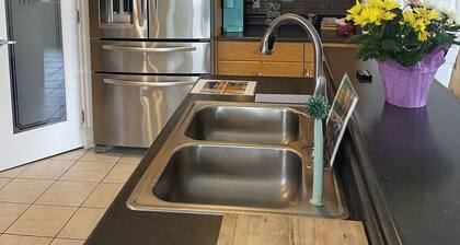 Spacious bungalow with large backyard and garage close to West Ed Mall