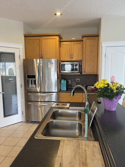 Spacious bungalow with large backyard and garage close to West Ed Mall