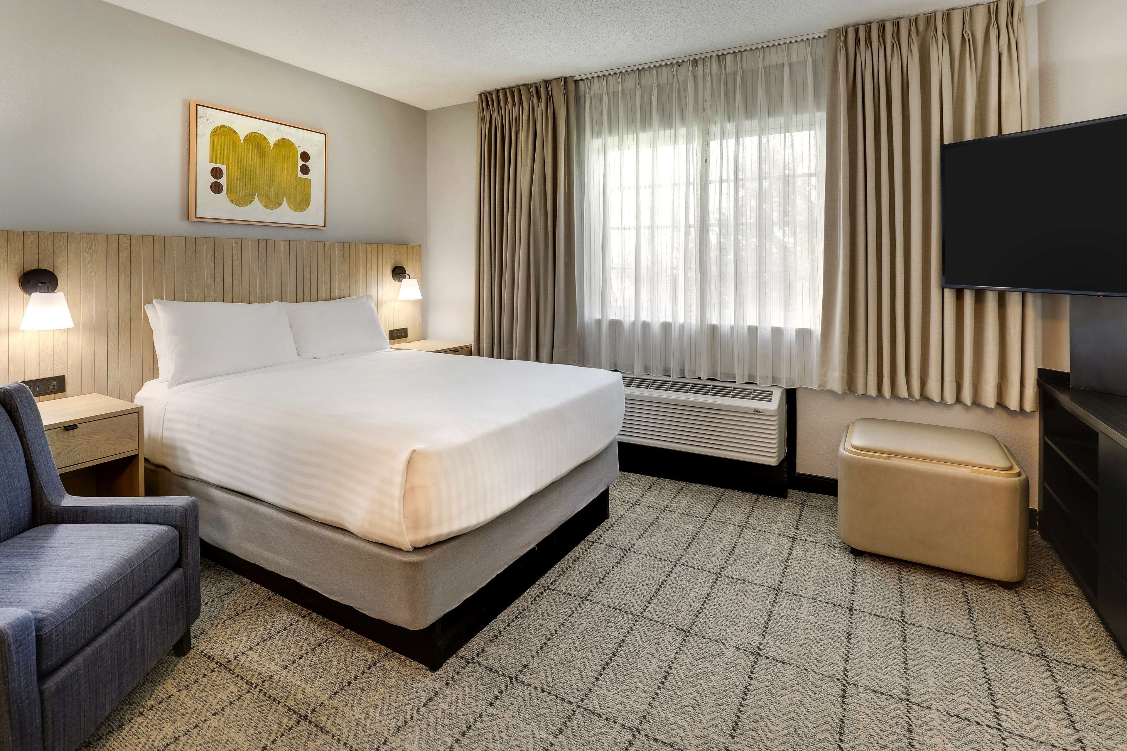 Unwind in a crisp, cloud-soft bed after busy days.