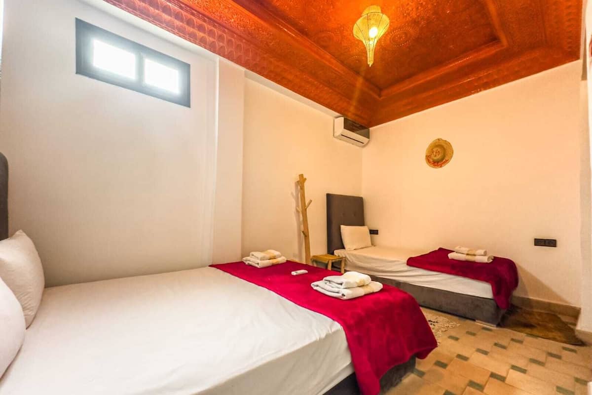 Signature Triple Room | 1 bedroom, down comforters, memory foam beds, individually decorated