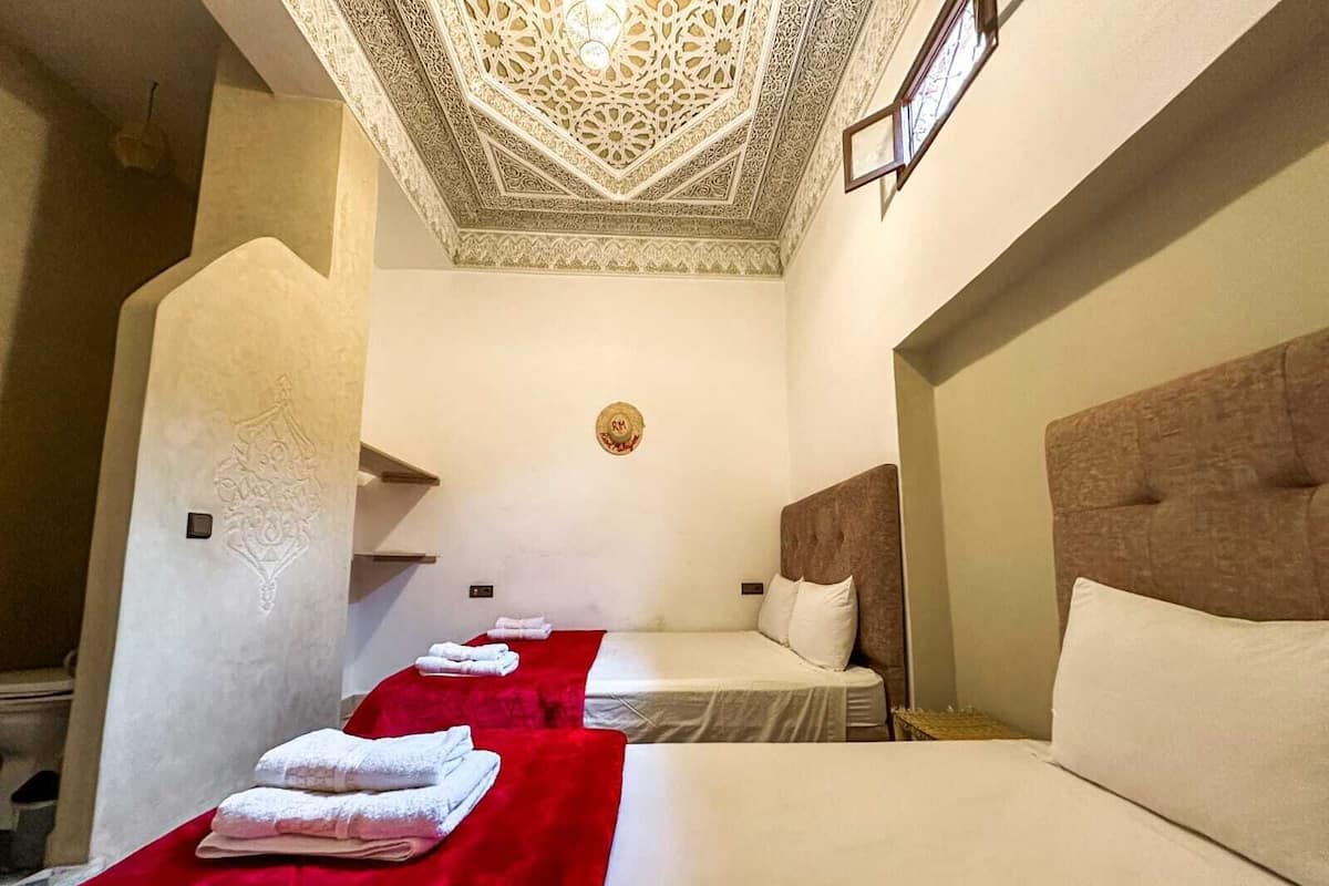 Design Triple Room | 1 bedroom, down comforters, memory foam beds, individually decorated