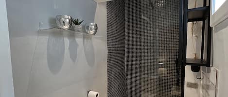Shower, hair dryer, towels, toilet paper