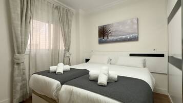 3 slaapkamers, een strijkplank/strijkijzer, gratis wifi, beddengoed