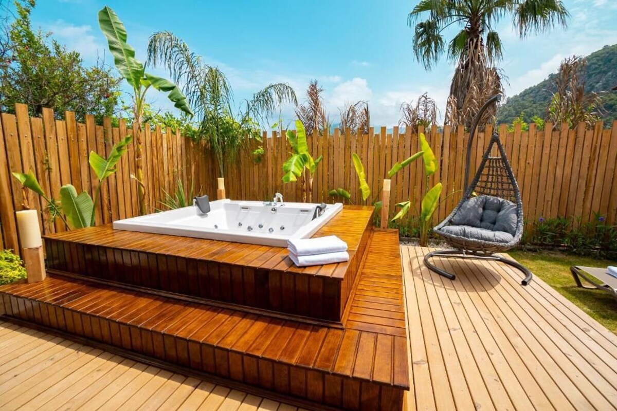 Premium Villa, Jetted Tub, Pool View | Premium bedding, minibar, desk, blackout drapes