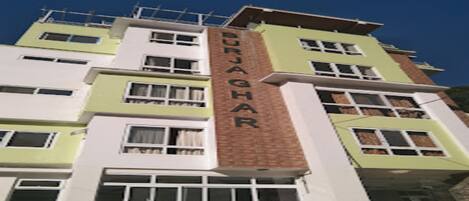 A multi-story building with the name "BURJAGHAR" on the facade.